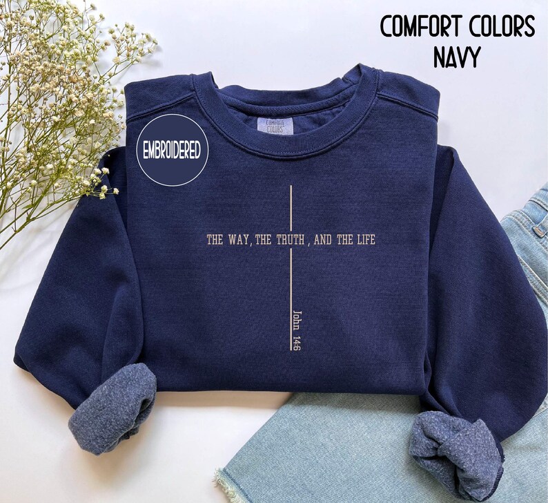 May include: Navy blue embroidered sweatshirt with the text "THE WAY, THE TRUTH, AND THE LIFE" and "John 14:6". The sweatshirt also has the words "COMFORT COLORS NAVY" on the top right.