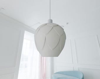 May include: White pendant light fixture with a unique, textured, flower-shaped shade.