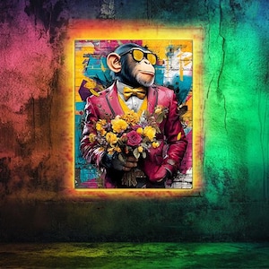 May include: A framed artwork featuring a chimpanzee in a red suit, yellow bow tie, and sunglasses, holding a bouquet of flowers. The background is a colorful, textured wall with a neon-lit frame around the artwork. The overall theme is a whimsical, artistic portrait.