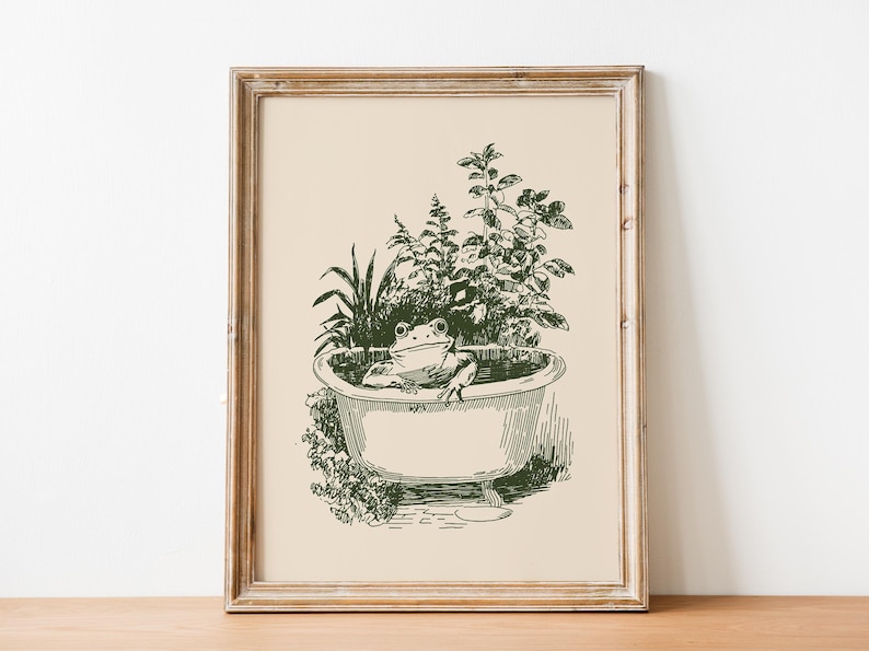 Ink-style drawing of a frog relaxing in a bathtub surrounded by leafy plants, with a soft vintage cottagecore look. Neutral simple art for guest bathroom decor.