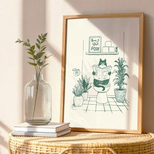 Minimal green line art illustration of a cute cat reading a newspaper on a toilet with potted plants and a “Have a Nice Poop” sign, funny bathroom art poster.