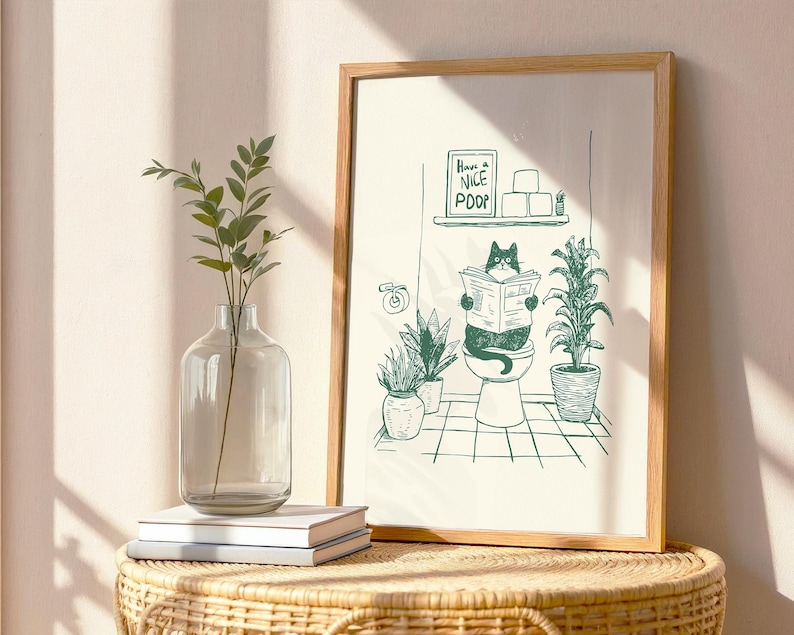 Minimal green line art illustration of a cute cat reading a newspaper on a toilet with potted plants and a “Have a Nice Poop” sign, funny bathroom art poster.