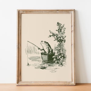 Hand drawn poster of a fishing frog sitting in a bucket by the water, ink drawing with vintage line art style, frog wall art for lake house decor, cabin decor, and fishing wall art.