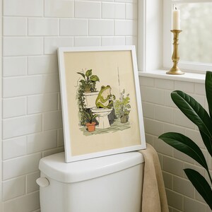 Hand drawn poster of a frog on toilet surrounded by plants, frog bathroom art for powder room art and restroom wall art, cute bathroom art with toilet humor art and bathroom humor sign vibe.