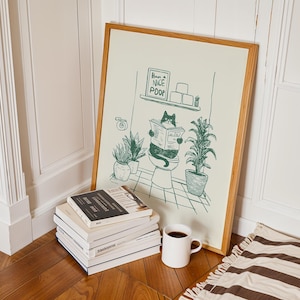 Minimal green line art illustration of a cute cat reading a newspaper on a toilet with potted plants and a “Have a Nice Poop” sign, funny bathroom art poster.