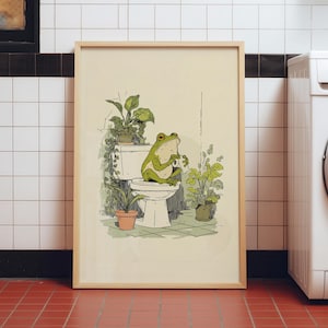 Hand drawn poster of a frog on toilet surrounded by plants, frog bathroom art for powder room art and restroom wall art, cute bathroom art with toilet humor art and bathroom humor sign vibe.