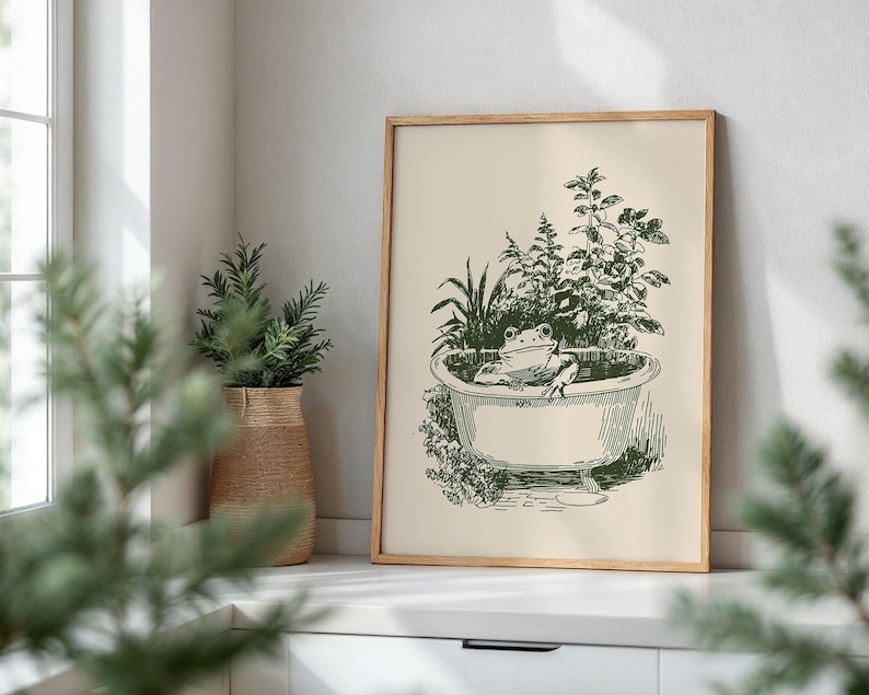 Ink-style drawing of a frog relaxing in a bathtub surrounded by leafy plants, with a soft vintage cottagecore look. Neutral simple art for guest bathroom decor.