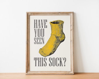 May include: A framed print with a yellow sock and the text "Have you seen this sock?"