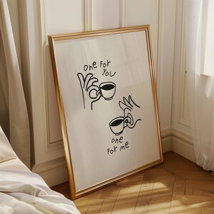 Minimalist line art coffee poster showing two mugs with a "One for you, one for me" quote in a modern kitchen setting.