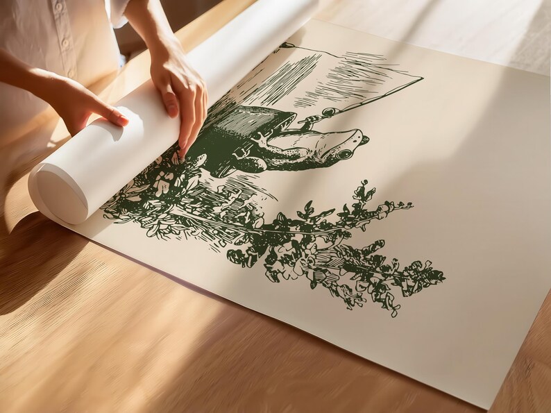 Hand drawn poster of a fishing frog sitting in a bucket by the water, ink drawing with vintage line art style, frog wall art for lake house decor, cabin decor, and fishing wall art.