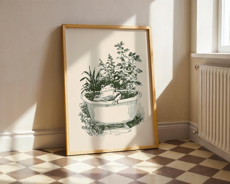 Ink-style drawing of a frog relaxing in a bathtub surrounded by leafy plants, with a soft vintage cottagecore look. Neutral simple art for guest bathroom decor.