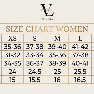 May include: A size chart for women's clothing, featuring measurements for bust, waist, hips, sleeves, and shoulder. Sizes range from XXS to XXXL, with measurements in inches. The chart includes the brand logo "VELVISTA".