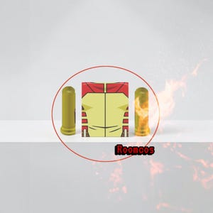 May include: A yellow and red superhero torso with two yellow cylinders and a cylinder with a flame design. The text "Roomcos" is at the bottom. The items are arranged on a white surface.