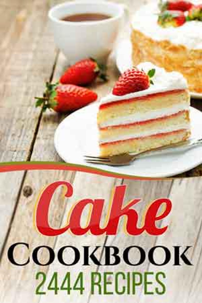 May include: A slice of layered cake with strawberries on a white plate, a fork, and a cup of tea on a wooden table. The cake has white frosting and red filling. The image also includes the text "Cake Cookbook 2444 Recipes".