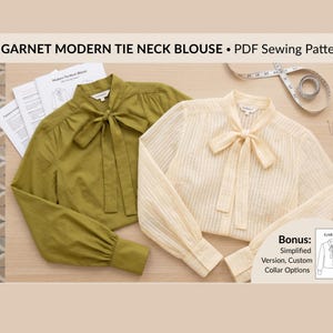 May include: Two long-sleeve blouses with tie necks, one in solid olive green and one in cream with vertical stripes. The text GARNET MODERN TIE NECK BLOUSE • PDF Sewing Pattern is visible, along with a measuring tape and printed instructions.