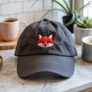Charming Red Fox with Fluffy White Chest and Tail Tip Embroidered in Vibrant Colors on a Classic Black Cap