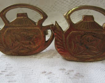 Two Brass Napkin Rings in the Shape of Teapots