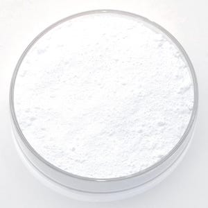 May include: A clear, round container filled with a fine, white powder. The powder has a slightly textured appearance, filling the container to the top. The container has a clear, transparent rim.
