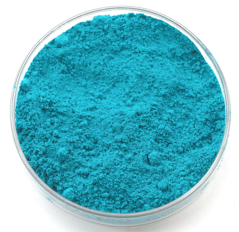 Verdigris pigment, a vibrant blue-green made from copper acetate, historically prized for its intense hue and transparency. Used in oil, watercolor, and tempera painting, it offers brilliant color but requires careful handling due to moderate lightfastness. Favored by Renaissance artists for glazing and decorative arts. Finely ground for professional-quality applications. Available in various sizes.