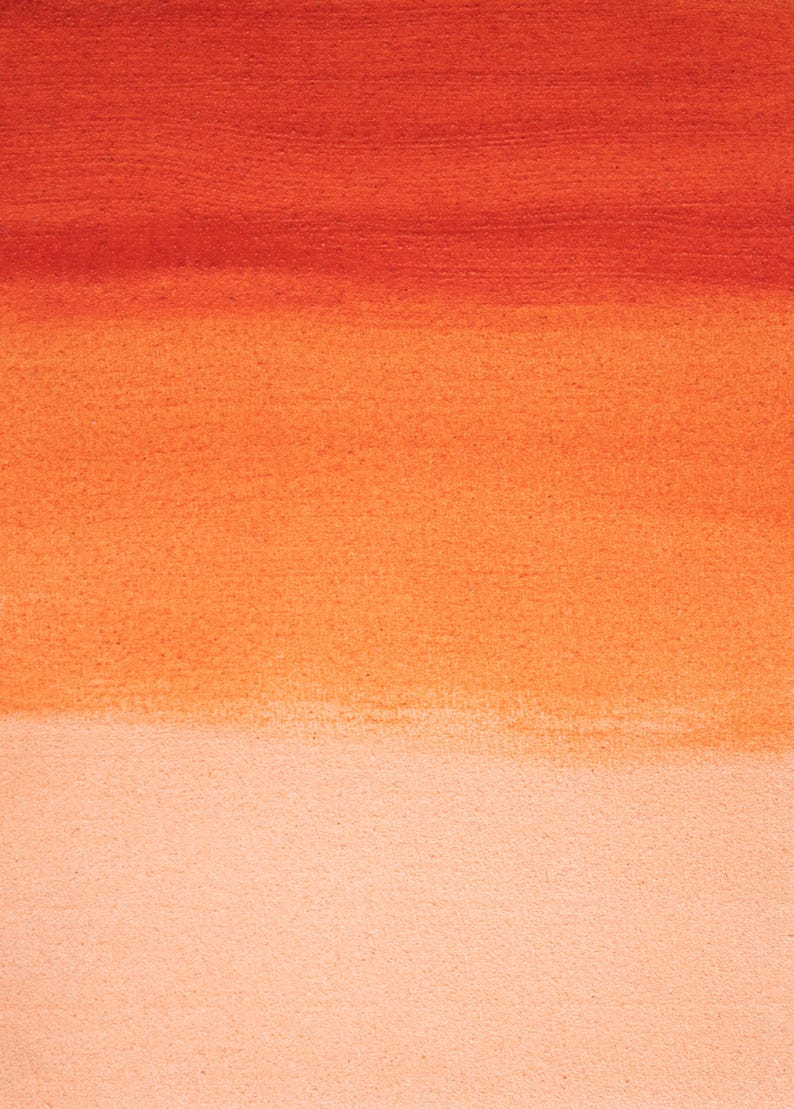 May include: Abstract watercolor painting with a gradient of warm colors. The image transitions from a deep reddish-orange at the top to a light peach at the bottom, creating a soft, textured effect. The artwork is suitable for home decor.