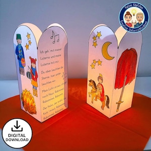 Puede incluir: Dos faroles de papel con ilustraciones de niños, estrellas y una luna creciente. Un farol presenta una hoguera y un poema en alemán. El otro farol tiene un caballero a caballo y una espada. Los faroles están sobre una superficie naranja.