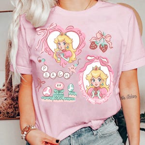 Maglietta con i personaggi del film Super Mario Galaxy e fiocco cocchi, maglietta Super Mario Luigi Peach Princess Trip, Universal World immagine 3