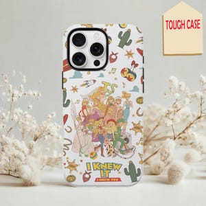 May include: A white phone case featuring a colorful collage of illustrated characters and icons including cacti, sheriff stars, rockets, and musical notes. The text "I KNEW IT" is printed in yellow and red near the bottom of the phone case.