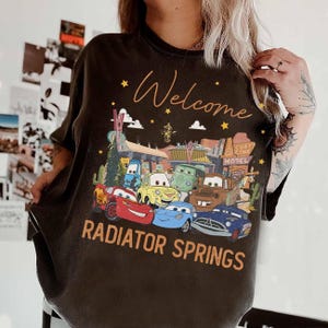 Disney Pixar Cars Groups Radiator Springs Tee, Cars Lightning McQueen Tow Mater Doc Hudson Sally Disneyland Trip 2026 Tee, WDW Trip Tee image 2