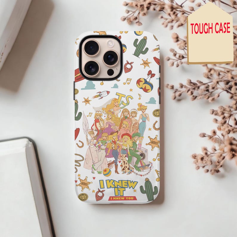 May include: A white phone case featuring a colorful collage of various illustrated characters and western-themed icons like cacti, sheriff stars, and bandanas. The text TS appears at the top, with I KNEW IT I KNEW YOU printed at the bottom.