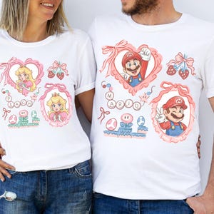 Maglietta con i personaggi del film Super Mario Galaxy e fiocco cocchi, maglietta Super Mario Luigi Peach Princess Trip, Universal World immagine 2