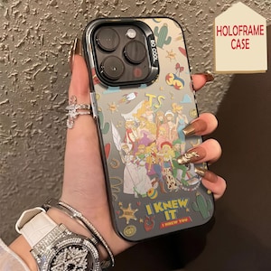 May include: A clear smartphone case featuring a colorful collage of various cartoon characters, cacti, rockets, and stars. The text "I KNEW IT" and "I KNEW YOU" is printed at the bottom. The case has a black camera module frame with the text "SO COOL".