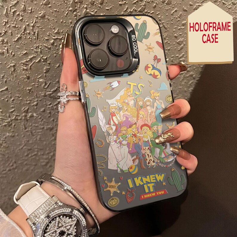 May include: A clear smartphone case featuring a colorful collage of various cartoon characters, cacti, rockets, and stars. The text "I KNEW IT" and "I KNEW YOU" is printed at the bottom. The case has a black camera module frame with the text "SO COOL".