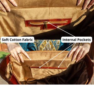 May include: A brown leather bag interior lined with soft cotton fabric. The bag features internal pockets, including one zippered compartment and two open slip pockets. Text labels in the image point to the Soft Cotton Fabric and Internal Pockets.