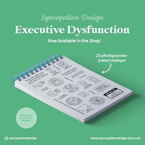 May include: A white spiral-bound notepad with blue coils, featuring various black stamp designs and text. The notepad includes the words "Executive Dysfunction" and "23 photopolymer (clear) stamps!" on a green background.