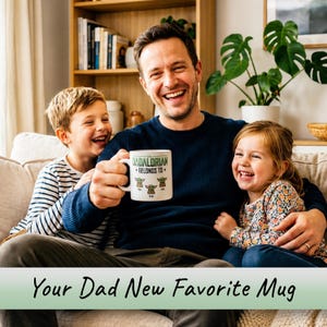 May include: A white ceramic mug featuring the green text "THE DADALORIAN BELONGS TO" above three cartoon illustrations of small green creatures with large ears, each labeled with the names "Max," "Emily," and "Jack" in black text.
