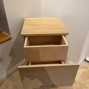Bedside cabinet with hidden drawer