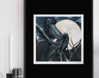 May include: A watercolor painting of two black crows perched on a branch with a full moon in the background. The painting is framed in black and has the text "Crow Moon 2022" and "D. Alan Wilton" at the bottom.