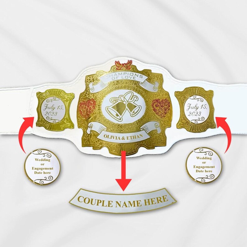 May include: A white and gold championship belt with the words "Champions of Love" and "Olivia & Ethan" on it. The belt has two gold plates with the date "July 15, 2023" on them. The belt also has a white banner that says "Couple Name Here".