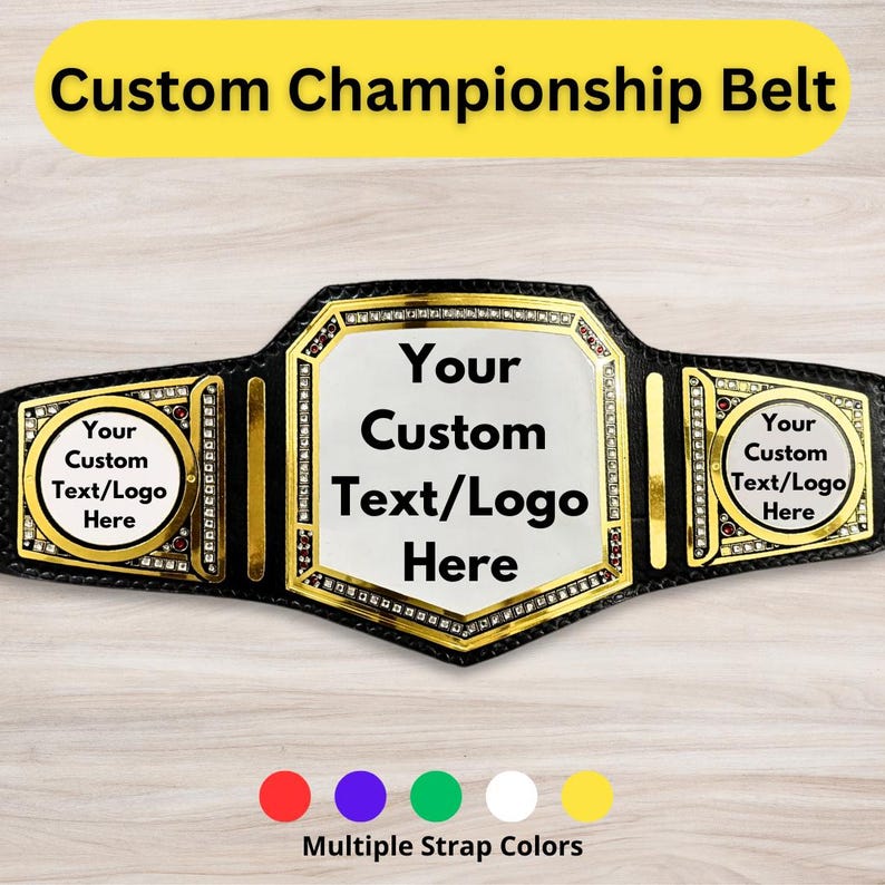 May include: A black championship belt with gold accents and a large, clear, customizable plate in the center. The plate says "Your Custom Text/Logo Here". There are two smaller plates on the sides that also say "Your Custom Text/Logo Here". The belt is on a light wood background. There are five colored dots below the belt: red, purple, green, white, and yellow.