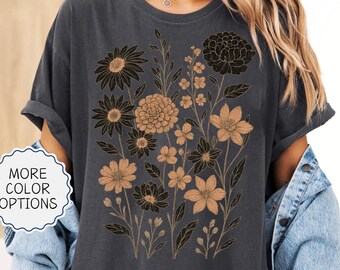 May include: Dark gray t-shirt featuring a floral design in black and tan. The shirt has rolled-up sleeves and the text "MORE COLOR OPTIONS" is visible. The word "PEPPER" is also visible. The shirt colors can be slightly darker or lighter due to photographing.