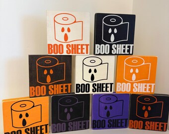 Letrero de baño con la frase "BOO Sheet" de Halloween