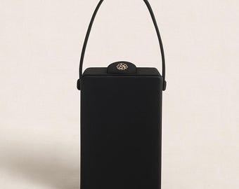 Dorette Minaudières Sac à main noir structuré années 50 avec poignée sur le dessus