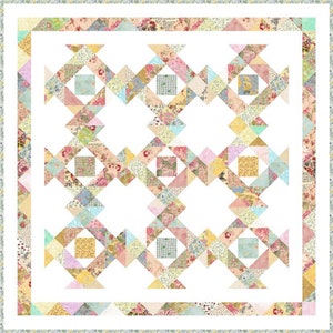 May include: A quilt with a white background and a pattern of pink, blue and yellow triangles. The quilt is surrounded by a border of floral fabric.