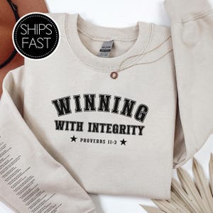Proverbs 11:3 Game Day Gift for Her Him Christian Sweatshirt Custom Bible Verse Sleeve Winning With Integrity Personalised Sports Gift Idea