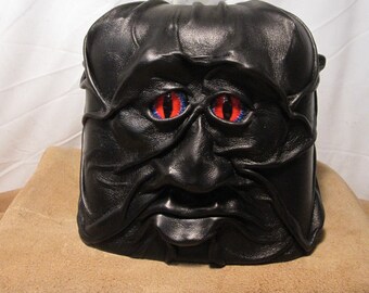 Grichels leather tissue box cover - black with red and cobalt blue slit pupil eyes