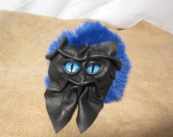 Grichels fake fur puffball keychain - black with cobalt blue slit pupil eyes