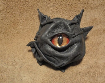 Grichel leather magnet - charcoal gray with red and gold slit pupil shark eye