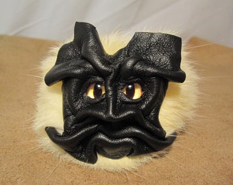 Grichels fake fur puffball keychain - black with yellow slit pupil eyes