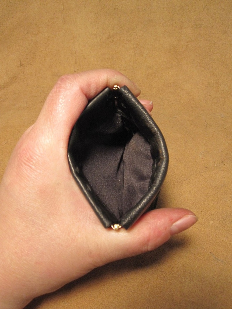 Grichels leather pinch style coin purse scaly black with pink and red albino eyes
