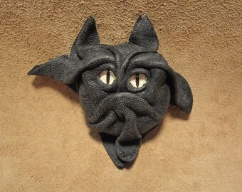 Grichel leather magnet - soft charcoal black with brown speckled slit pupil eyes